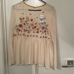 Dress it up or down, this top has great details